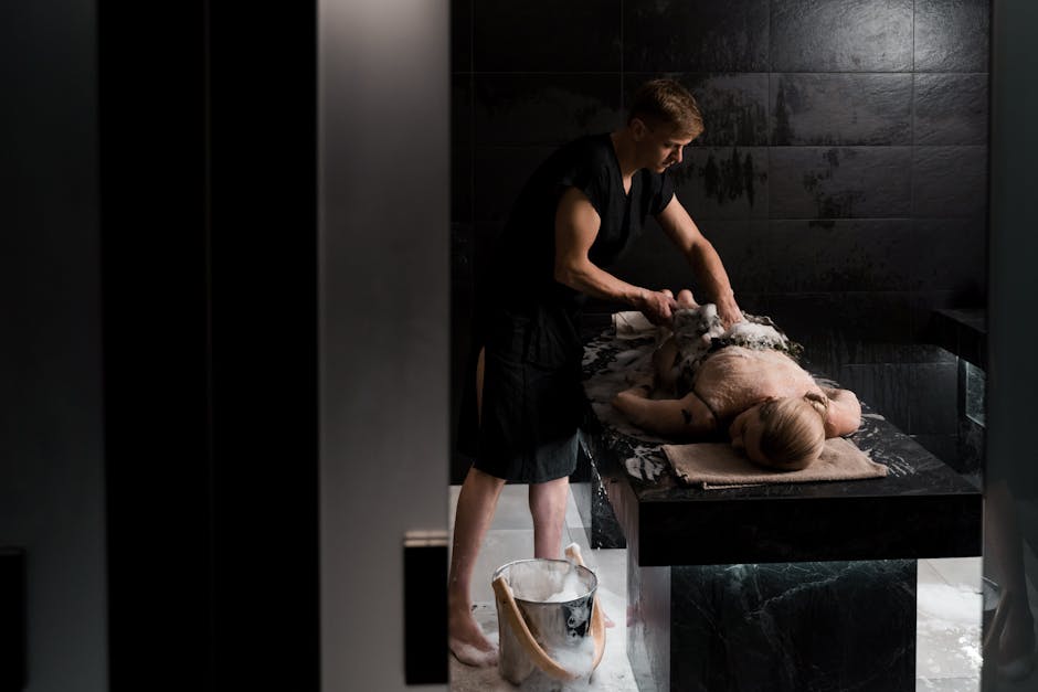 A professional giving a soothing soap massage in a relaxing spa environment